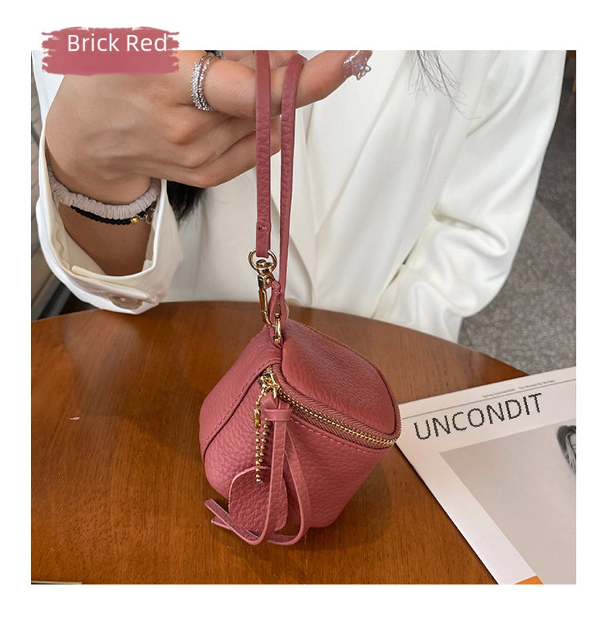 coin Purse head layer cowhide coin bag coin bag hand carrying leather key bag headset lipstick air cushion bag