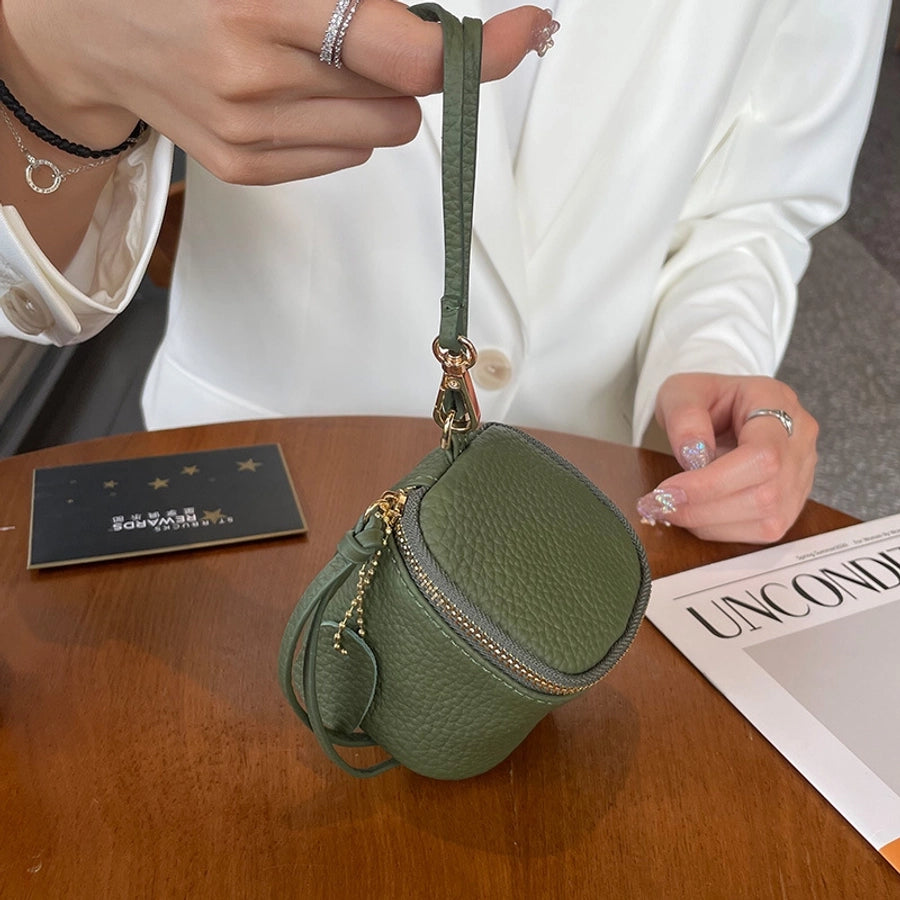 coin Purse head layer cowhide coin bag coin bag hand carrying leather key bag headset lipstick air cushion bag