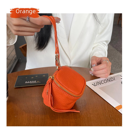 coin Purse head layer cowhide coin bag coin bag hand carrying leather key bag headset lipstick air cushion bag
