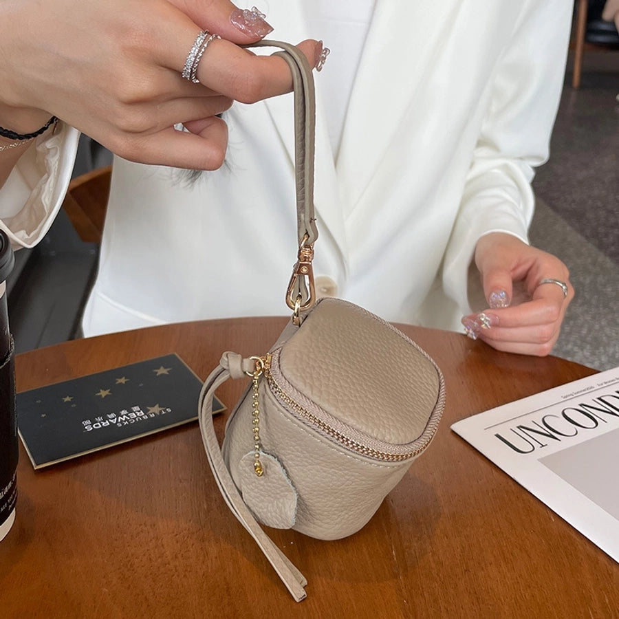 coin Purse head layer cowhide coin bag coin bag hand carrying leather key bag headset lipstick air cushion bag
