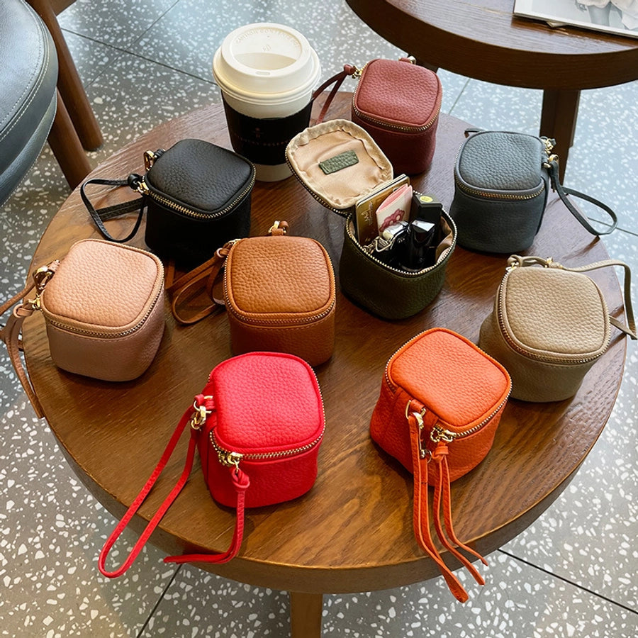 coin Purse head layer cowhide coin bag coin bag hand carrying leather key bag headset lipstick air cushion bag
