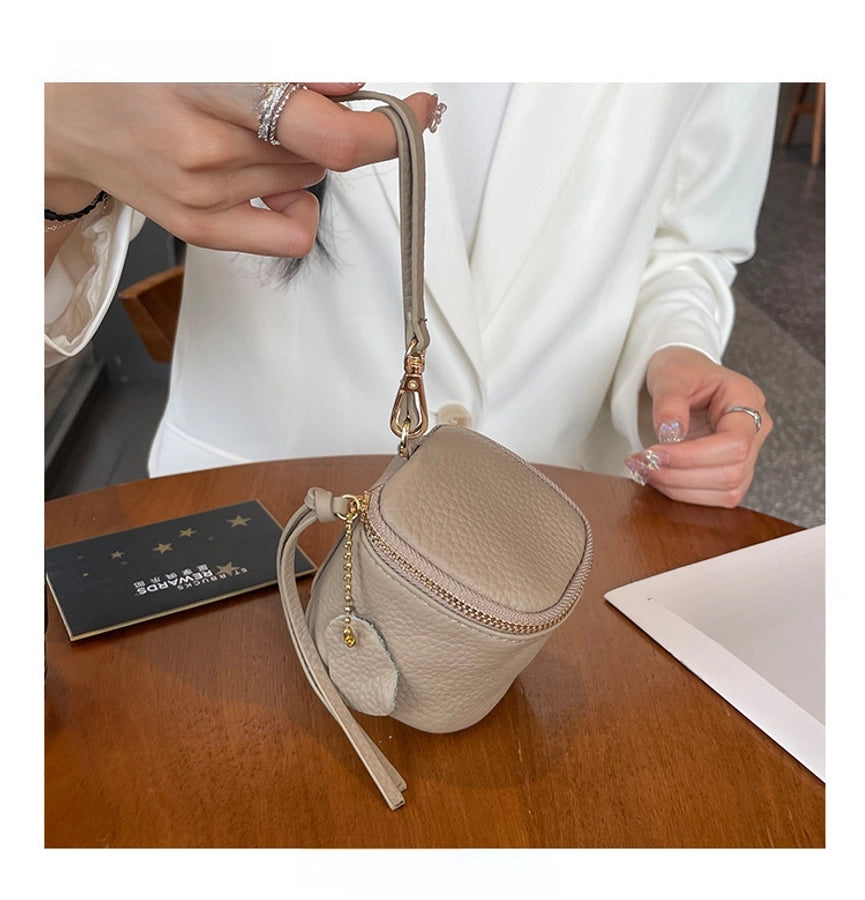 coin Purse head layer cowhide coin bag coin bag hand carrying leather key bag headset lipstick air cushion bag