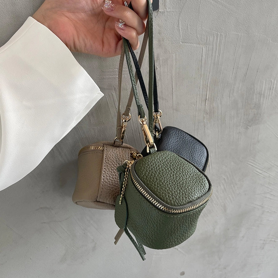 coin Purse head layer cowhide coin bag coin bag hand carrying leather key bag headset lipstick air cushion bag