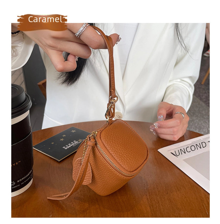coin Purse head layer cowhide coin bag coin bag hand carrying leather key bag headset lipstick air cushion bag